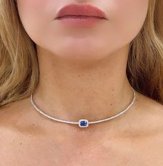 Indulge in luxury with our stunning 2.50carat choker featuring an eye-catching cushion -cut blue sapphire center. This exquisite tennis necklace will add a touch of elegance and sophistication to any outfit. Elevate your look and make a statement with this timeless piece. Metal: 14K White GoldDiamond Details: 108 Brilliant Round Cut Diamonds 1.45ct tw Blue Sapphire: Cushion-cut 1.05carat Lenght: 14 + 2" - W: Sapphire center: 10 x 8mm Sapphire Choker Necklace, Sapphire Choker, Necklace Guide, Diamond Initial Necklace, Jewelry Appraisal, Diamond Choker, Bridal Engagement Rings, Jewelry Rings Diamond, Tennis Necklace