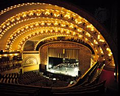 an empty theatre with lights on the stage