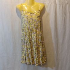 Tag Size Medium. Style Rw520695. Yellow Purple Multicolored Floral Print. Tiered Gathered Skirt. Flat Armpit To Armpit 16 Inches, Has Elastic Across Back. Length From Shoulder 34 Inches. Adjustable Straps. 100% Rayon. New With Tag As Shown. Casual Yellow Printed Sundress, Yellow Printed Sleeveless Mini Dress, Yellow Floral Print Sundress For Daywear, Spring Yellow Printed Sundress, Yellow Summer Sundress For Daywear, Summer Yellow Sundress For Daywear, Yellow Printed Sundress Mini Dress, Yellow Flowy Sleeveless Mini Dress, Yellow Flowy Sleeveless Sundress