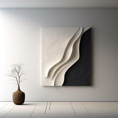 an abstract painting hangs on the wall next to a vase with a plant in it