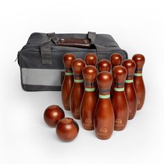 a group of wooden bowling pins sitting next to each other on top of a bag