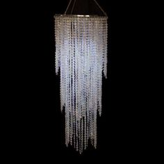 a chandelier hanging from the ceiling in a dark room