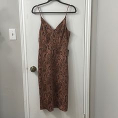 Tank Dress Brown Knee-length Midi Dress For Parties, Brown Knee-length Midi Dress For Night Out, Brown V-neck Midi Dress For Cocktail, Brown V-neck Midi Dress For Parties, Brown Midi Length Dress For Date Night, Brown Sheath Midi Dress For Formal Occasions, Brown Sheath Midi Dress For Party, Brown Sheath Midi Dress For Date Night, Brown Evening Dress, Midi Length