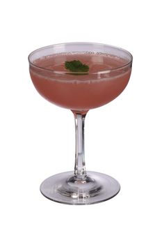 a pink drink in a glass with a green garnish on the rim, ready to be served