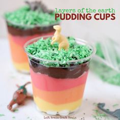 two dessert cups filled with green and red frosting, topped with a toy horse