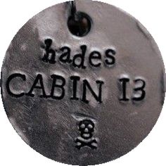 a metal tag that says, hades cabin 13