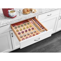 Keep your kitchen drawers clean and clutter-free with the 22'' K-Cup Solid Wood Custom Kitchen Drawer Insert from Rev-A-Shelf. This custom kitchen drawer insert measures 22'' by 19.75'' by 2.38'' and can help transform any ordinary drawer into a clean, accessible coffee or tea beverage station. With a Five-Tier durable wood construction with a clear finish, this accessory can hold 30 pods at once. Featuring extra utensil storage on the side, you'll be able to customize your cleaning needs. The t Custom Kitchen Drawers, Kitchen Drawer Inserts, Pod Storage, Coffee Pod Storage, Kitchen Drawing, Classic White Kitchen, Utensil Storage, Rev A Shelf, Storage Shed Plans