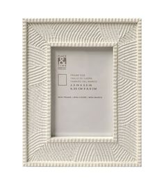 a white frame with an intricate pattern on the front and bottom, is shown against a white background