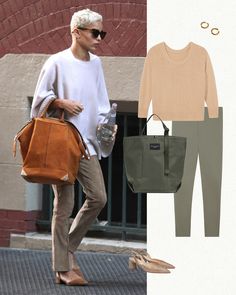 a woman in white sweater and khaki pants walking down the street with a handbag