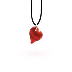 Handcrafted by Dan Neff, these heart pendants are the perfect way to show your love. They are available in amber, green, teal, purple, pink, and red. *Please note that while we do our best to create a cohesive series, not every piece will be identical as it is all handmade and subject to variations. Includes gift box and black satin cord that is adjustable from 14" to 26". Dimensions: 1.5" long x 1" wide Heart Cut Keepsake Necklace For Valentine's Day, Elegant Teardrop Necklace With Heart Charm, Keepsake Heart Pendant Jewelry With Heart Beads, Handmade Heart-cut Elegant Necklaces, Handmade Heart Cut Elegant Necklaces, Red Pendant Necklace For Keepsake, Elegant Keepsake Necklaces With Heart Beads, Handmade Elegant Heart Cut Necklaces, Red Keepsake Pendant Necklace