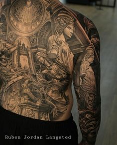 the back of a man with tattoos on his arms and shoulder is covered in artwork