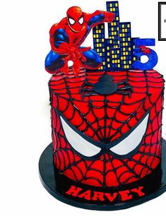 a spiderman cake with the words happy on it