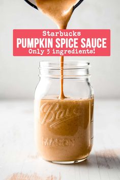 pumpkin spice sauce being poured into a mason jar with text overlay reading starbuck's pumpkin spice sauce only 3 ingredients