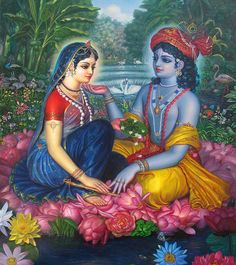 two women sitting next to each other in front of a pond with flowers on it