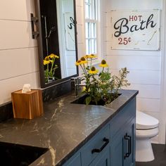 This lovely master bathroom has a vanity with Mariana Soapstone countertop and backsplash with two custom under-mount sinks! Soapstone Shower Walls, Soapstone Countertops Bathroom, Farmhouse Western Decor, Floating Vanity Bathroom, Soapstone Counters, Countertop Backsplash, Soapstone Countertops, White Bathroom Cabinets