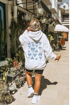 This "Respect the Locals" Shark hoodie by Gildan is perfect for beach lovers! This soft, high quality sweatshirt will keep you cozy and warm at the beach, post surfing, or chilling at home. Details 50% Cotton 50% Polyester (resistant to stretching and shrinking!) Front pouch pocket to keep your hands cozy and warm Knitted in one piece without side seams (reduces fabric waste!) Adjustable drawstring in hood Printed with non-hazardous, non-toxic, and biodegradable inks! SHIPPING Production time can take 2-7 business days, although the average time is 1.6 business days Shipping times in the US is 2-5 business days. *shipping to Alaska, Hawaii, Puerto Rico and unincorporated territories of the US can take an additional 7-12 business days. RETURNS Each sweatshirt is Print-on-Demand, meaning it Surfer Vibes Outfit, Hoodies Shark, Respect The Locals Shark, Respect The Locals, Surfer Vibes, Beach Post, Shark Sweatshirt, Shark Hoodie, Shark Lover