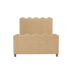 an upholstered headboard with scallops on the top and bottom side