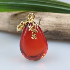 Deep Red amber pendant. Perfect stunning ruby red teardrop shape. Gold plated pendant. High quality. Teardrop shape elegant pendant. All natural parts, not a plastic. Very very small! Very very cute! Tiny gemstone pendant. Weight: 1,4 gr Pendant length 3,2 cm I ship within 1-2 business days. Due to pandemic it can take some time till You get it. Please be patient. If You aren't happy about Your order please contact me first. Cabochon Drop Jewelry For Gifts, Red Drop-shaped Jewelry For Gift, Red Drop Jewelry For Gift, Red Cabochon Round Pendant Jewelry, Red Polished Pendant Jewelry, Red Oval Pendant Jewelry With Polished Finish, Red Ruby Cabochon Necklace, Red Pendant Jewelry With Polished Finish, Red Ruby Drop Jewelry