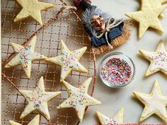 some cookies and sprinkles on a table