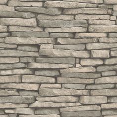 a stone wall with no mortar or mortars on the top and bottom, in grey tones