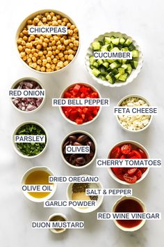 the ingredients for this healthy salad are shown in bowls on a white counter top, including red bell pepper, cucumber, cherry tomatoes, olives, parsley, garlic and onion