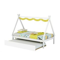 a white bed frame with yellow and blue bedspread on it, sitting next to a drawer