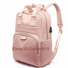 a pink backpack with straps on the front and back side, sitting against a white background