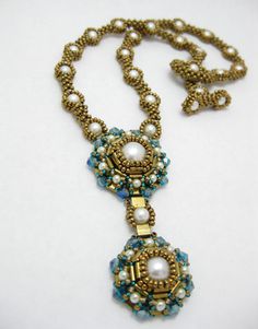 a necklace with beads and pearls on it