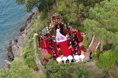 an aerial view of a wedding ceremony in the woods