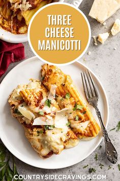 three cheese manicotti on a white plate with a fork and parmesan cheese