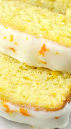 two slices of cake with white frosting and orange sprinkles