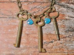 A great multi skeleton key necklace, these brass keys are very rare and unique. This authentic skeleton key necklace is a great piece with multiple unique skeleton and barrel keys. A one of a kind unique find and a great gift. I T E M ∙ S P E C I F I C A T I O N S: - NECKLACE: 22" on a chunky antique brass link chain - PENDANT: 3 authentic keys- Middle Key measures 2 1/2" long, side keys are 2" , 2 1/2" C A R E ∙ T I P S: We don’t want your special moment to fade. To maintain the quality of your Vintage Key Necklaces As Gift, Vintage Key Necklace Jewelry, Bronze Brass Necklace With Keys, Vintage Metal Key Jewelry, Skeleton Key Jewelry, Key Necklace Vintage, Skeleton Key Necklace, Skeleton Key Necklace Vintage, Key Jewelry