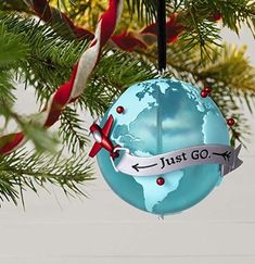 an ornament hanging from a christmas tree with the words just go on it