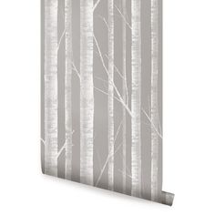 a wallpaper with grey and white trees in the woods on it's side