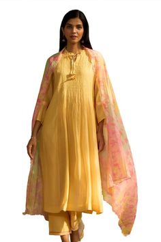 Yellow kurta with intricate smocking details, floral printed tie-up on sleeves and frill edged neckline. Comes with floral printed dupatta and embroidered hem pant. - Aza Fashions Bohemian Georgette Dupatta For Spring, Spring Bohemian Georgette Dupatta, Yellow Kurta, Embroidered Hem, Kurta Set For Women, Printed Dupatta, How To Hem Pants, Kurta Set, Pants Pattern