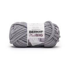 bernat plus big yarn ball in grey, with white trimming on the end