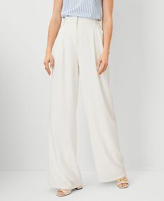 Our pleated wide leg pant is a modern must-have, with a perfect drape and high waist that endlessly flatters. Front zip with double hook-and-bar closure. Belt loops. Front pleats. Vertical on-seam pockets. Back besom pockets. Lined.,Leg Shape:Leg Shape: Wide Leg – a modern must-have with a statement leg and flattering high waist,Rise:High rise: sits 1/2" to 1" below natural waist,Imported:Imported,Fit:Fit: Relaxed & easy,Length:Full length: 32" inseam with 27" leg opening,Fabrication:92% Polyester, 8% Spandex,Garment Care:Machine Washable The Pleated Wide Leg Pant by Ann Taylor Size regular - 6 Winter White Women's Regular, Wide, Leg, Pants, 92%, Polyester, 8%, Spandex, Machine, Washable White Tailored Pants, White Pants Suit, Wide Leg Pants Winter, White Pants Winter, White Trouser Pants, Winter White Outfit, White Wide Leg Pants, White Dress Pants, White Clothing