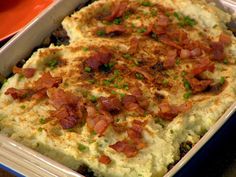 a casserole dish with meat and vegetables in it