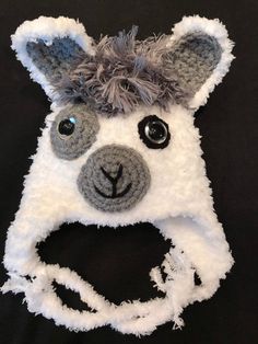 a crocheted animal hat with eyes and ears