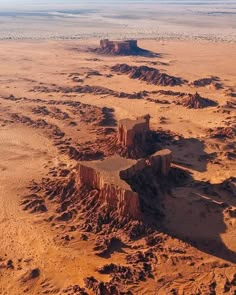 an aerial view of the desert with rocks and sand