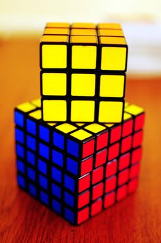 a rubik cube sitting on top of a wooden table