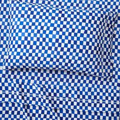 the blue and white checkered sheets are folded together