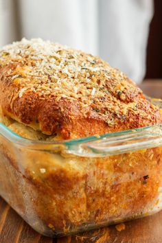 a casserole dish is sitting on a wooden table