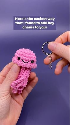 someone is holding a tiny crocheted keychain in their hand with the caption here's the easest way that i found to add key chains to your