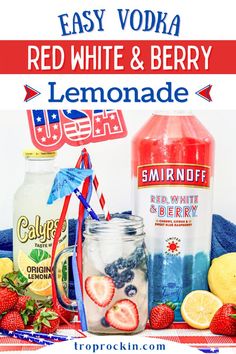 red, white and berry lemonade in mason jars with strawberries on the side