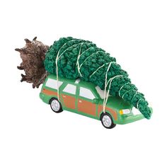 a green car with a christmas tree on top