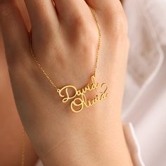 ❤️Perfect Gift for loved ones. ❤️DOUBLE NAME NECKLACE WITH HEART ❤️Your purchase will arrive in a gift box ❤️ All our jewelry is handmade with Love and Care in our workshop  DETAILS Material: High-Quality Solid 925 Sterling Silver  Finish: Silver Plated, Rose Plated, Gold Plated   PROCESSING & SHIPPING All items purchased will be shipped within 2-7 business days. You can upgrade your shipping to Express during check out if you want it faster 🚀Standard Shipping Time for the US: 2- 7 business days worldwide 🚀Express Shipping Time: 1-5 business days worldwide  ASSURANCE ✧ Nickel Free ✧ Tarnish Resistant ✧ High-Quality Materials ATTENTION PLEASE This necklace will be custom made especially for you by hand in our studio with love and care. We can't accept returns or exchanges on customised pi Anniversary Gift Name Necklace, Names Necklace For Anniversary Gift On Valentine's Day, Names Necklace For Anniversary, Valentine's Day Gift, Customized Name Necklace For Anniversary Gift, Personalized Name Necklaces For Anniversary On Valentine's Day, Personalized Name Necklaces For Valentine's Day Anniversary, Customized Necklace For Father's Day Anniversary Gift, Elegant Name Necklace For Father's Day, Engraved Name Necklace For Father's Day