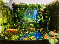 an image of a jungle scene made out of fake plants and animals in the background