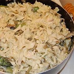 a pan filled with food sitting on top of a stove