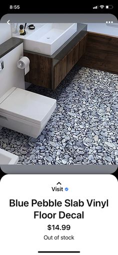 a bathroom with blue pebble slab vinyl floor decal on the walls and floors